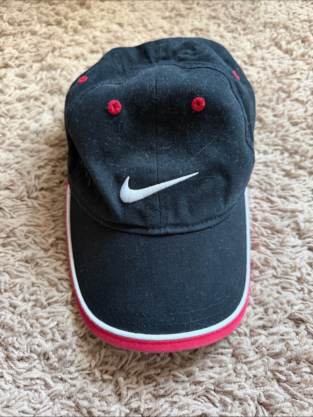 Nike Black Baseball Cap with White Swoosh and Red Accents for boys